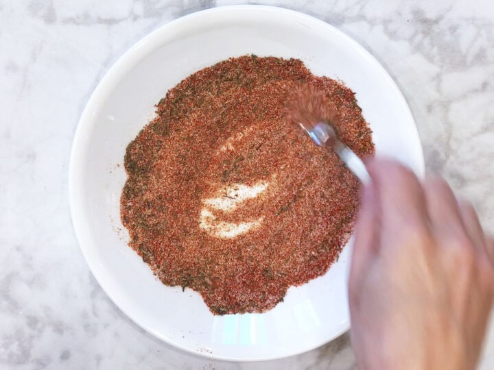 Mixing spices in a bowl.