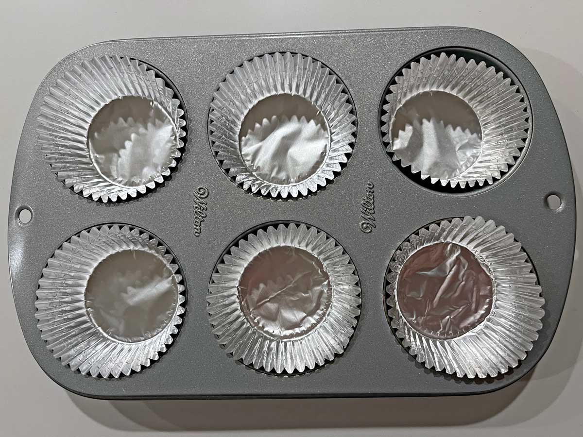 Muffin pan with foil liners.