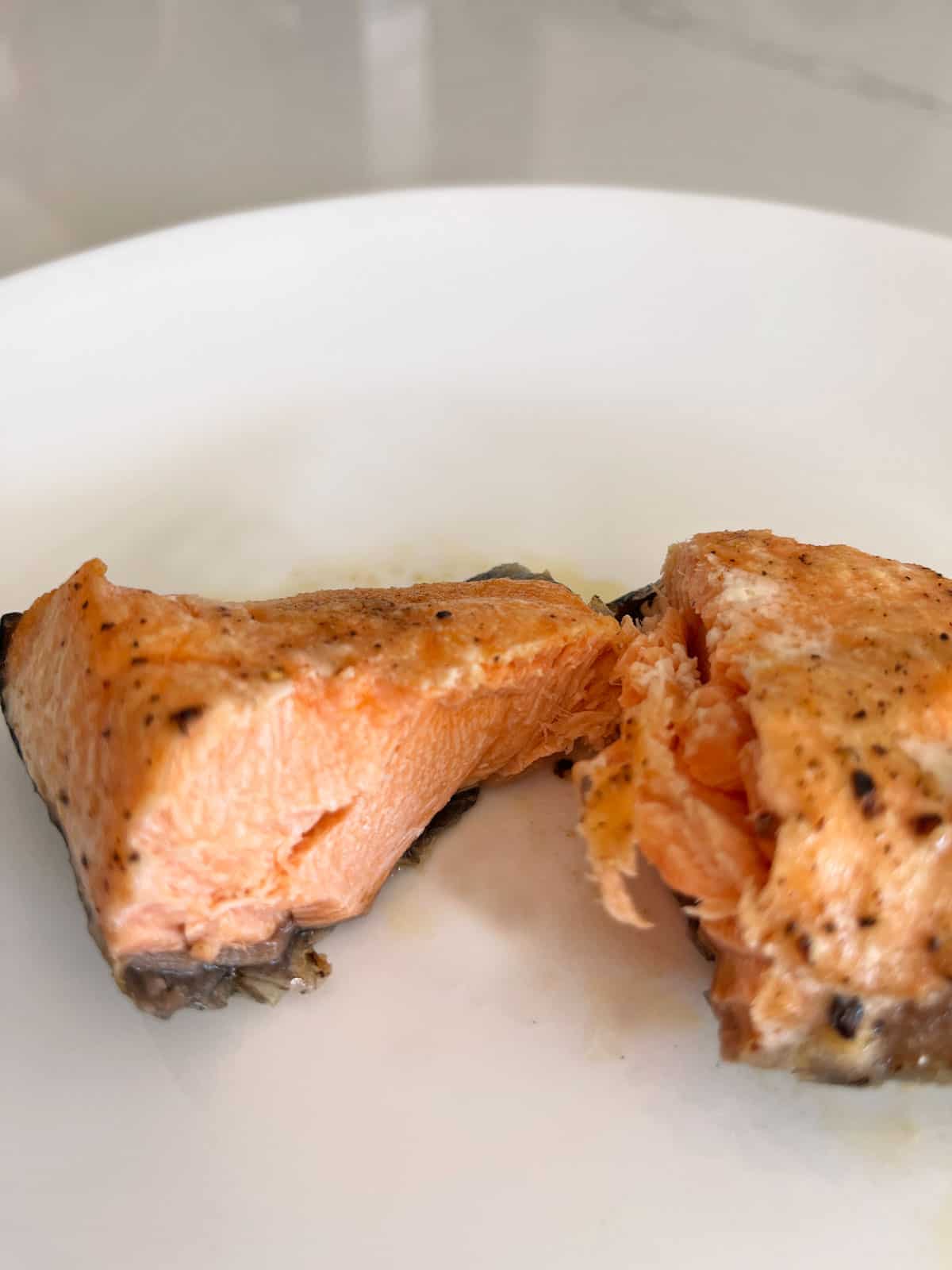 The inside of the overcooked salmon fillet appears dry. 