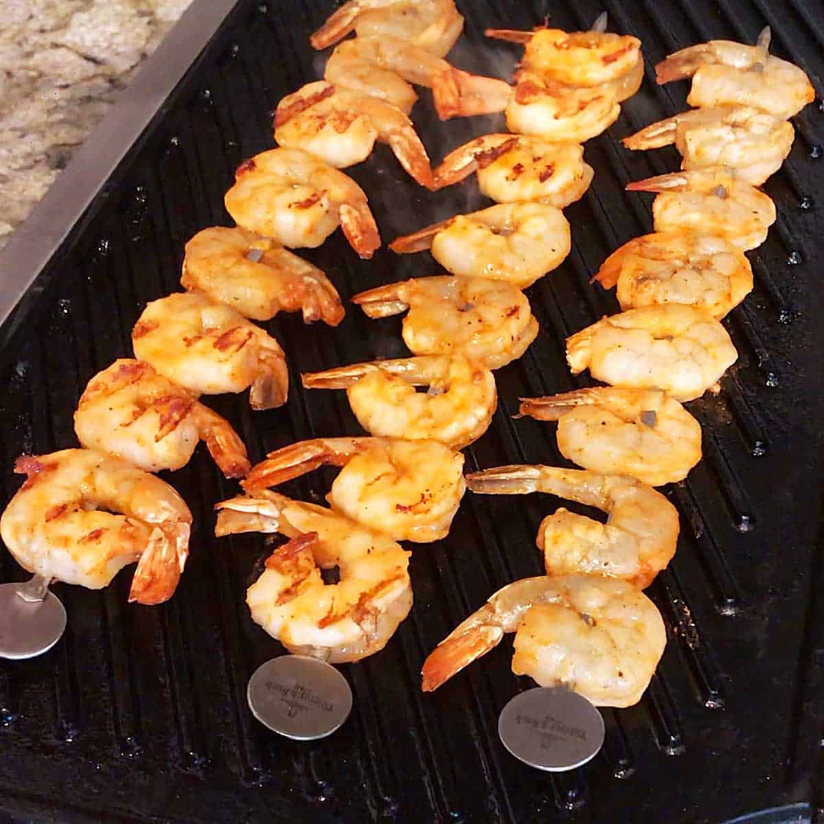 Shrimp skewers on the grill. 