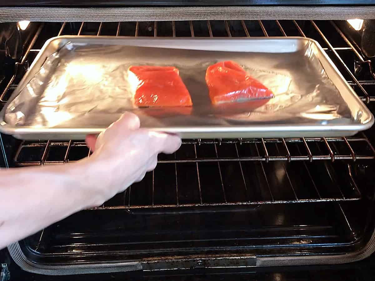 Placing the salmon under the broiler.