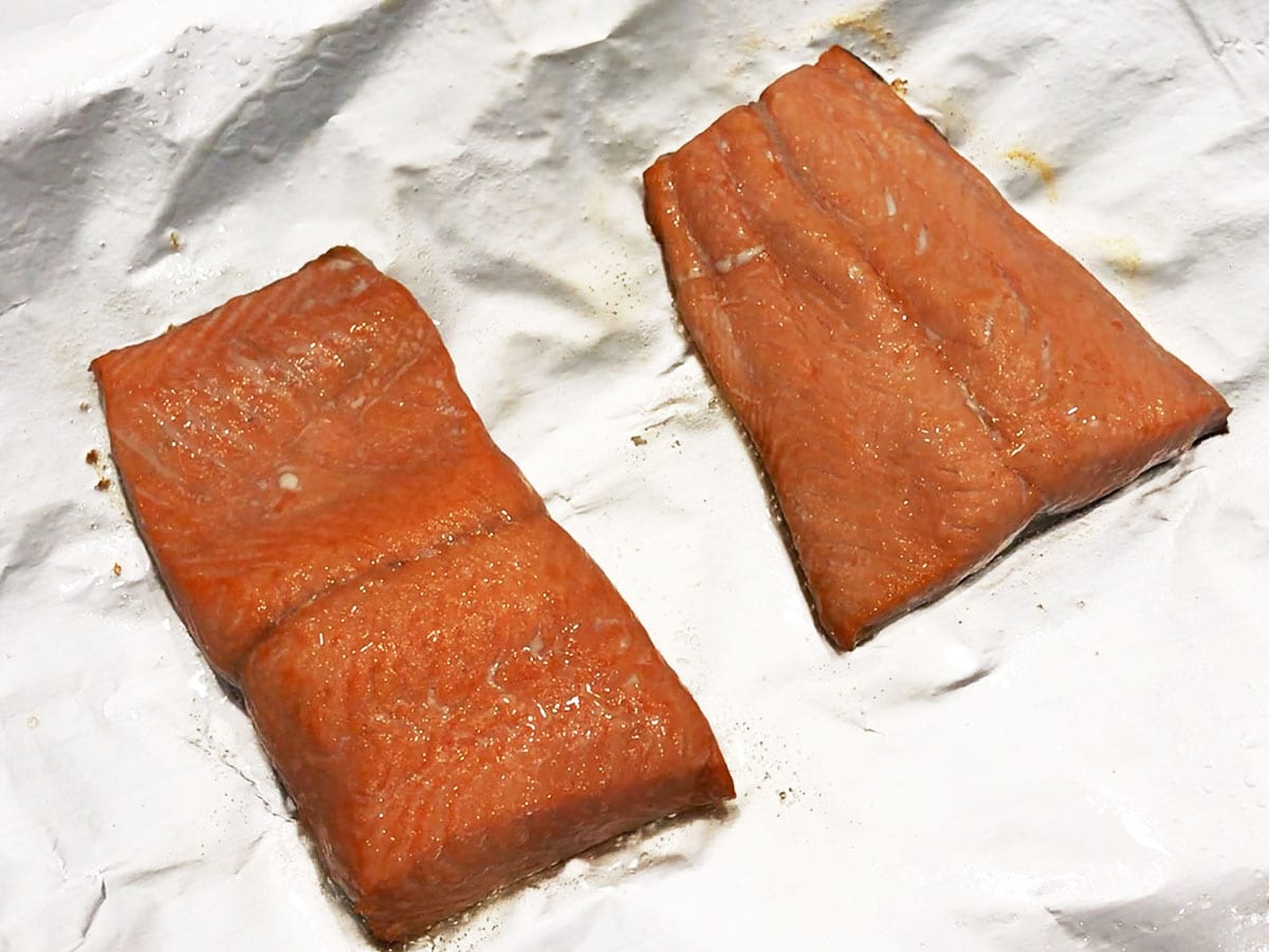The salmon fillets are fully cooked.