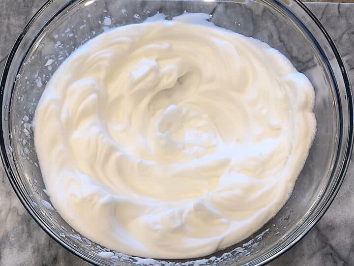 A bowl with whipped egg whites.