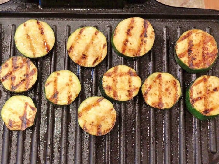 Zucchini slices on the grill.