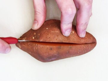 Cutting the sweet potato.