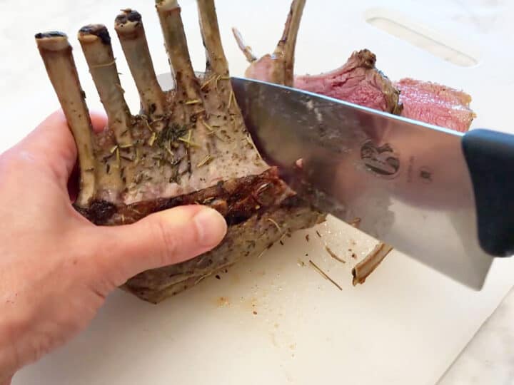 Cutting the rack of lamb.