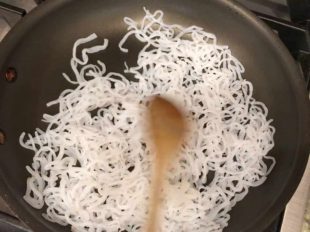 Dry-roasting the noodles in a dry skillet.