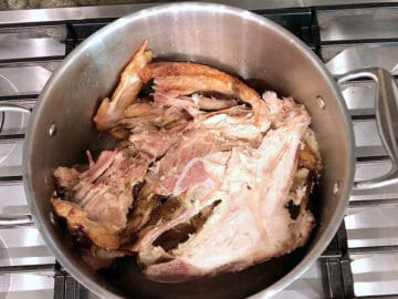 A turkey carcass in a stockpot.