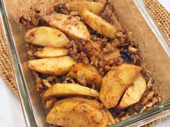 The apple crisp is ready in the pan.