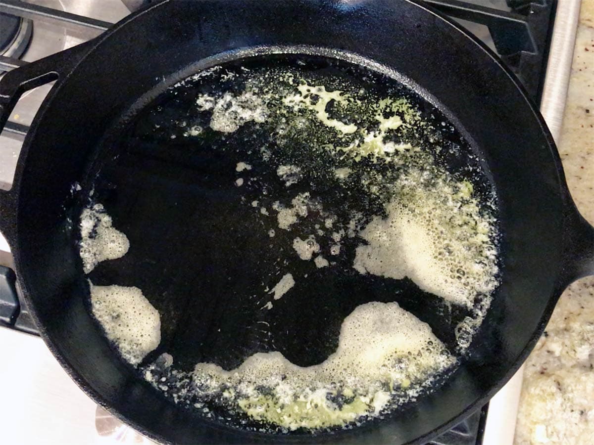Heating butter and oil in a skillet.