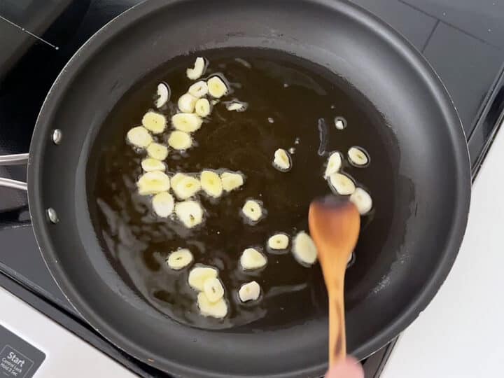 Cooking garlic in olive oil.