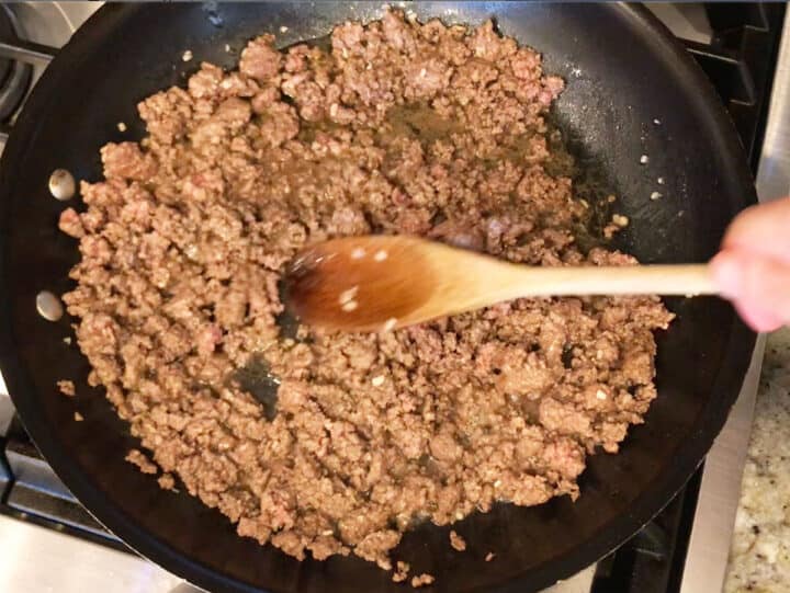 Cooking ground beef in a skillet.