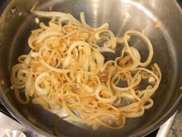 Golden onions in a skillet.