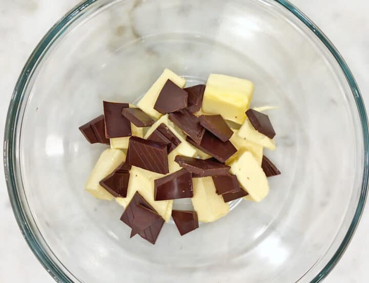 Chocolate and butter in a bowl, ready to be melted.