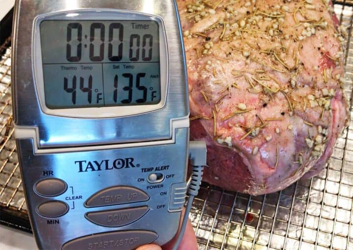 A thermometer inserted into the lamb.