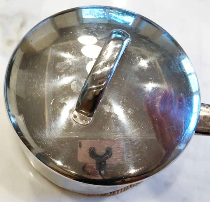A small saucepan covered with a lid.