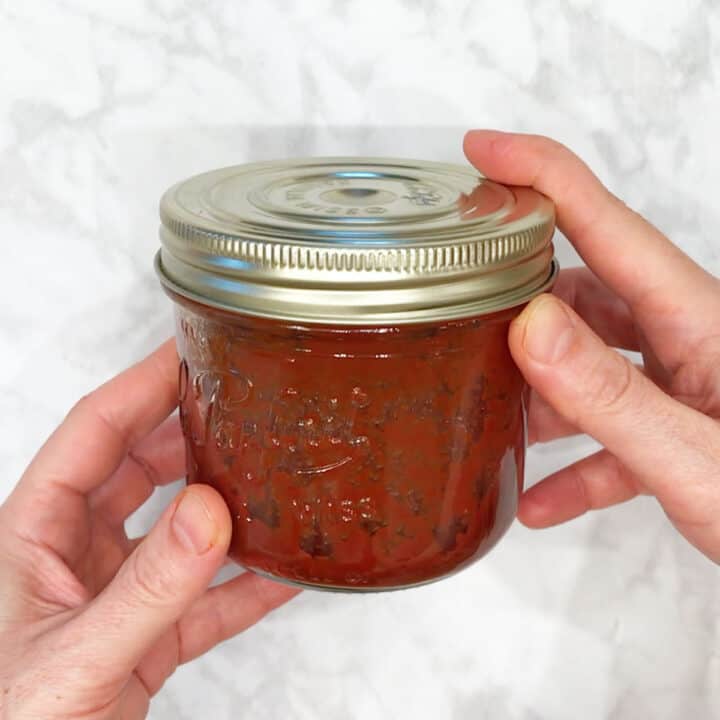 BBQ sauce in a jar with a closed lid for storage.