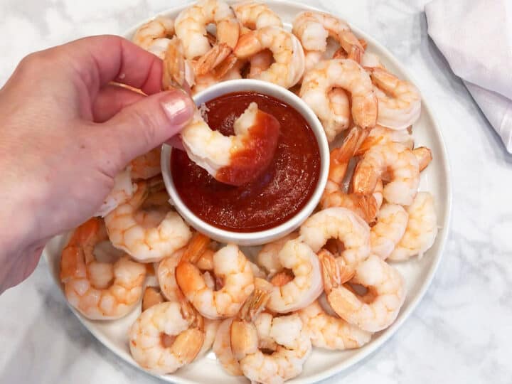 The shrimp are served with cocktail sauce.