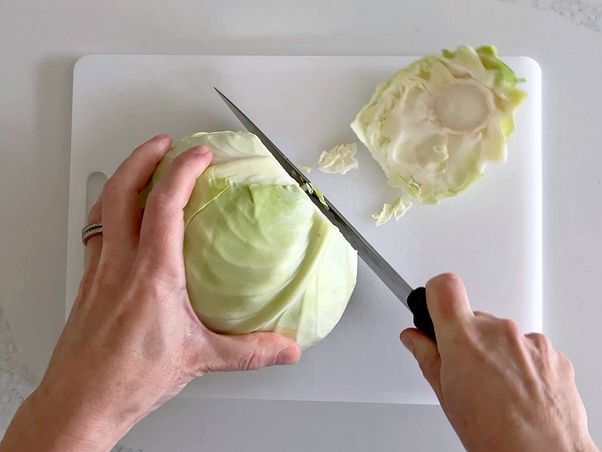 Removing the stem of the cabbage.