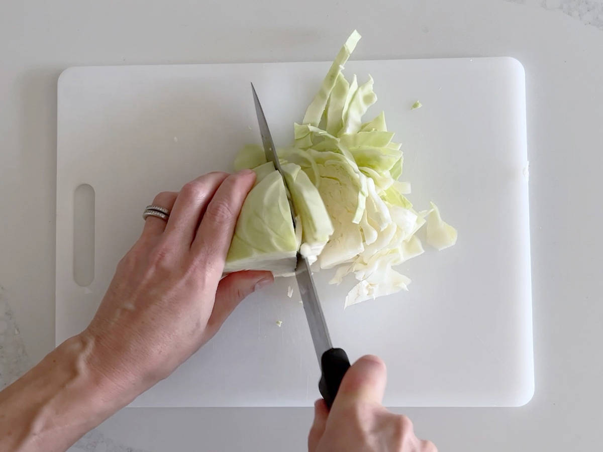 Slicing a cabbage.