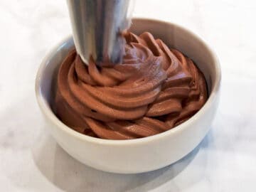 Piping the mousse with a pastry bag.