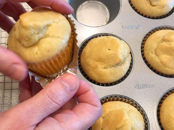 Removing the cupcake liners.
