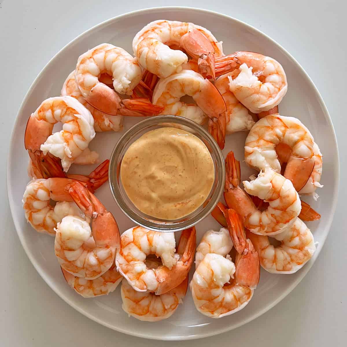 Boiled shrimp are served with sriracha mayo.