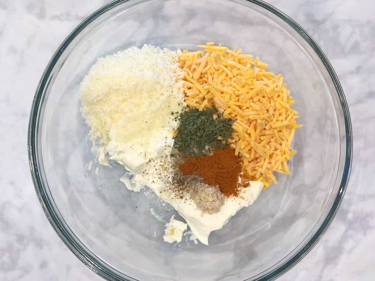 Cheese ball ingredients in a bowl.