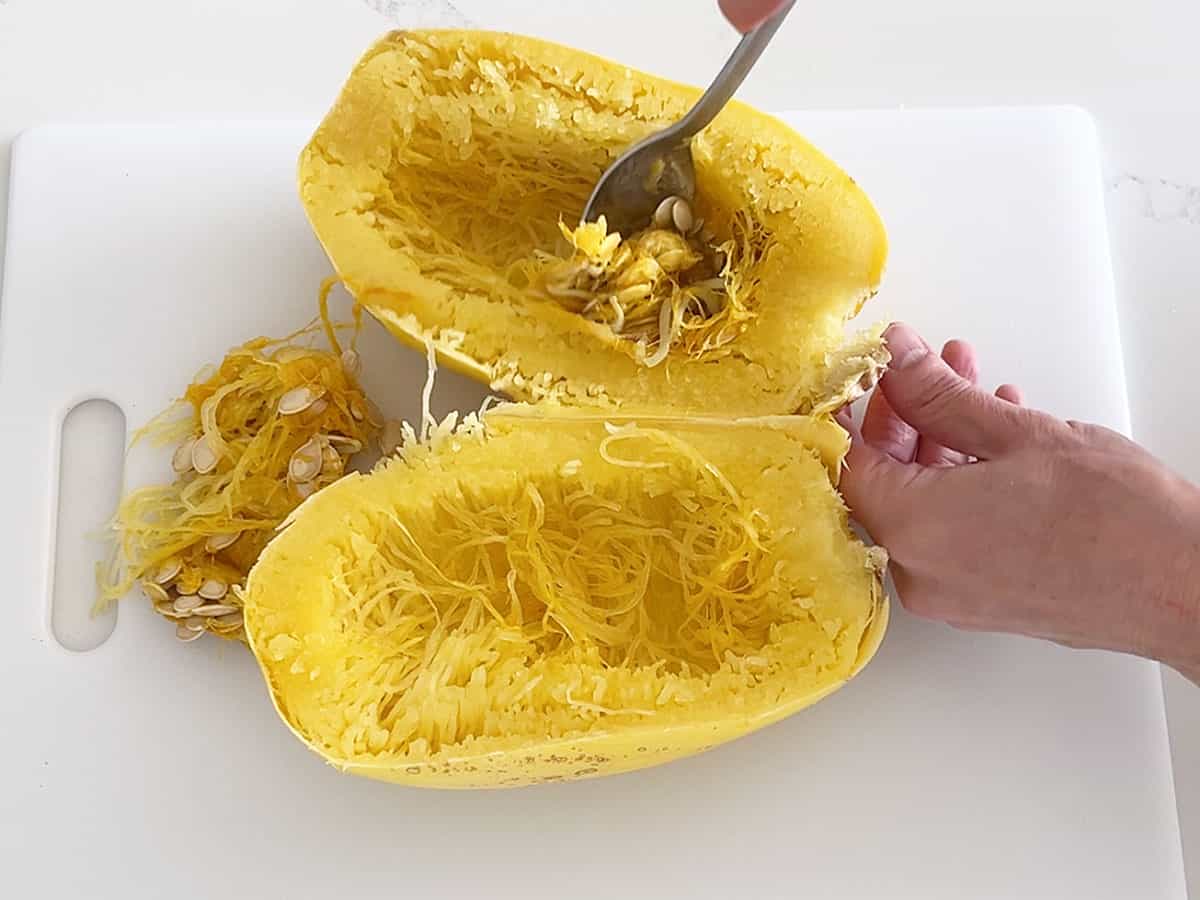 Removing the pulp and seeds from the squash.