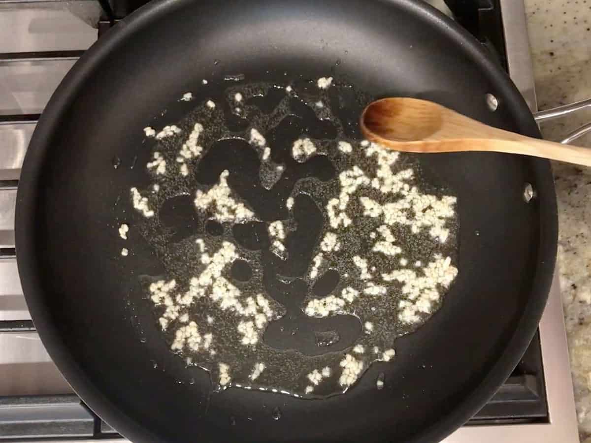 Cooking garlic in oil.