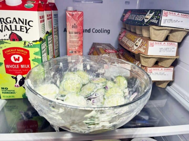 Creamy cucumber salad is resting in the fridge.