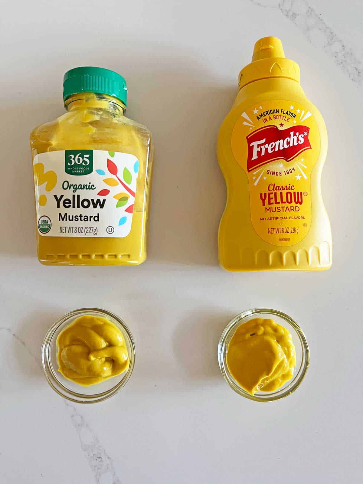 French's yellow mustard next to a store brand yellow mustard.