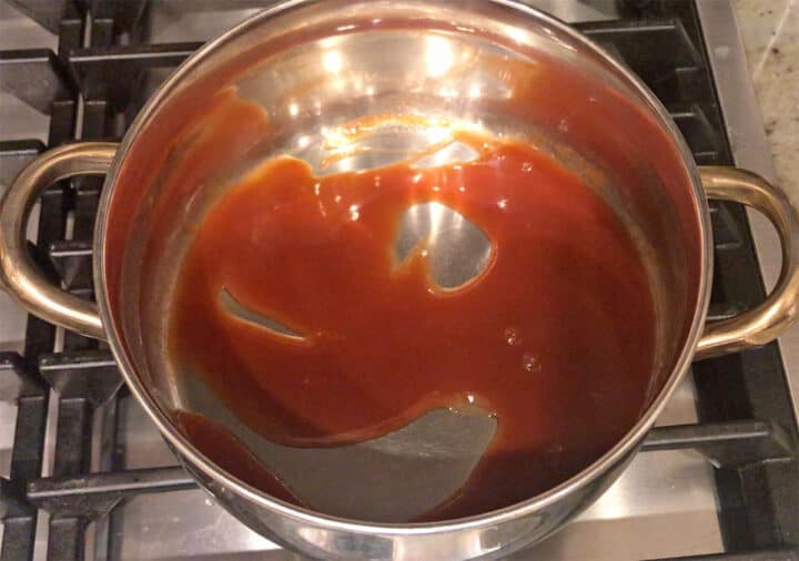 Heating the glaze in a saucepan.
