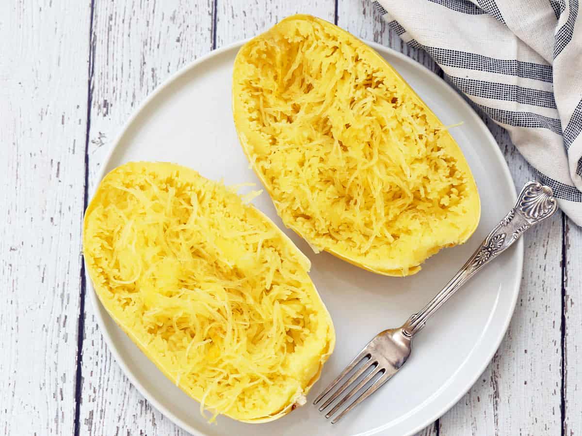 Microwave spaghetti squash is served on a plate.