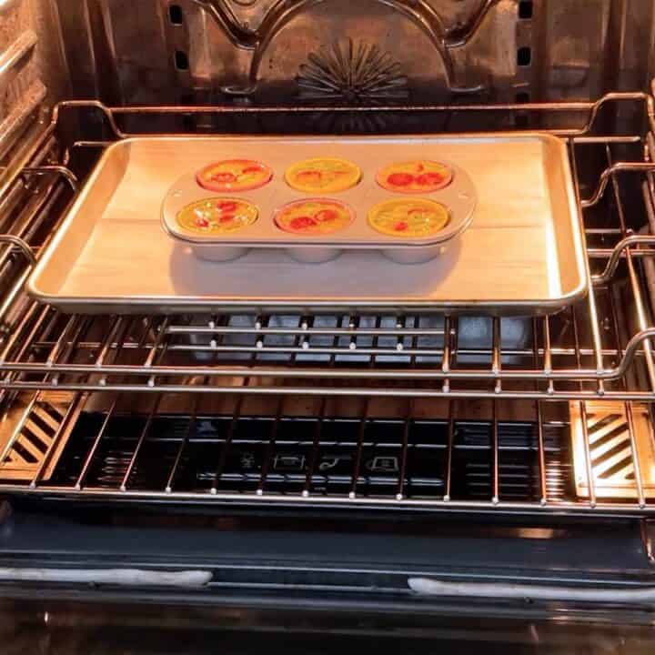 Placing the egg muffins in the oven.