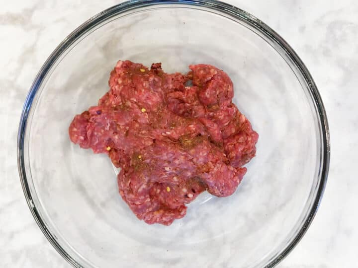Beef sausage ingredients are mixed.