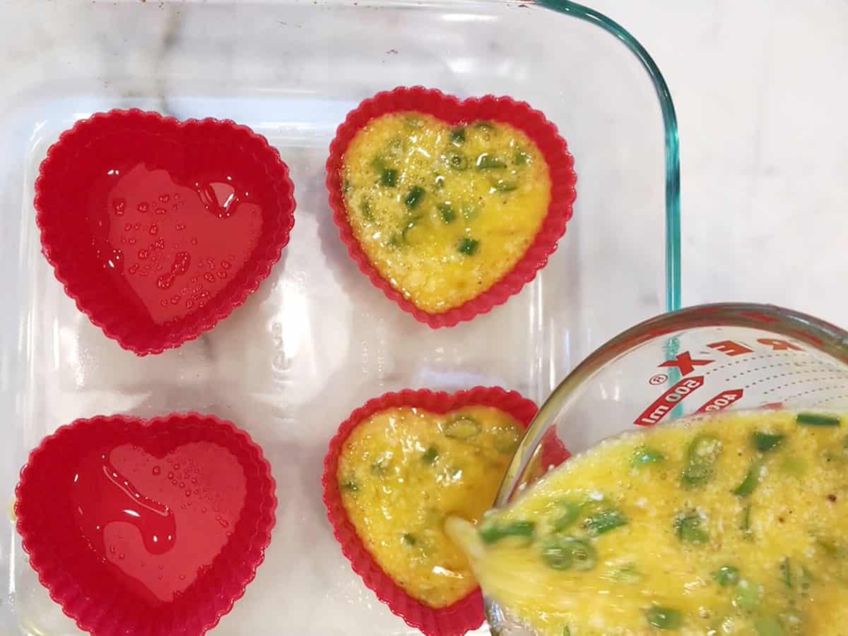 Silicone molds to make heart-shaped egg muffins.
