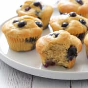 Keto blueberry muffins are served on a white plate.