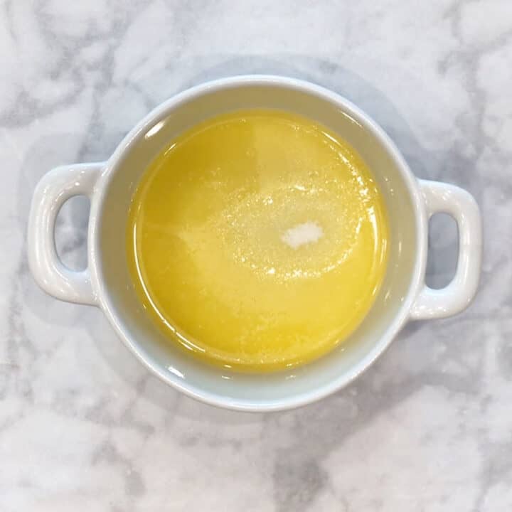Melting the butter in the ramekin.