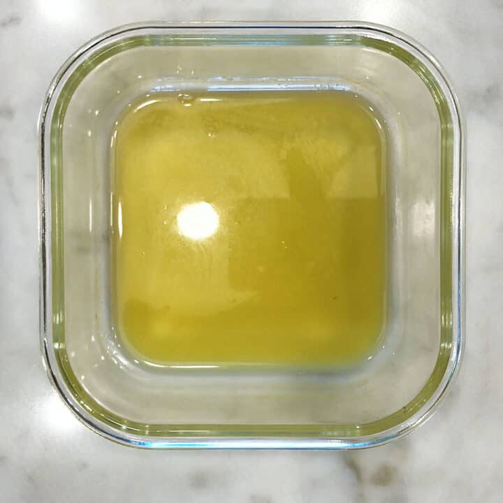 Melting butter in a glass container.