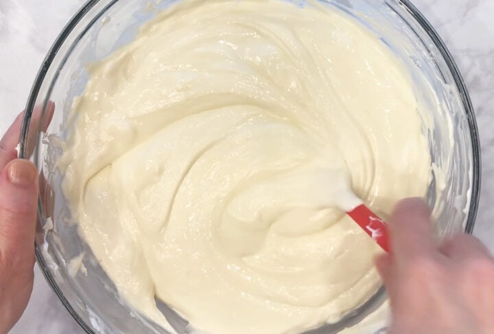 Mixing the batter with a spatula.