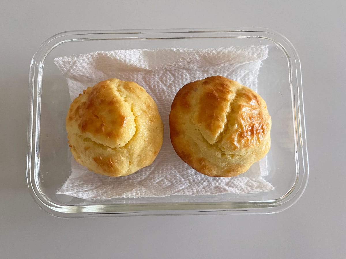 Storing protein muffins in a glass food storage container.