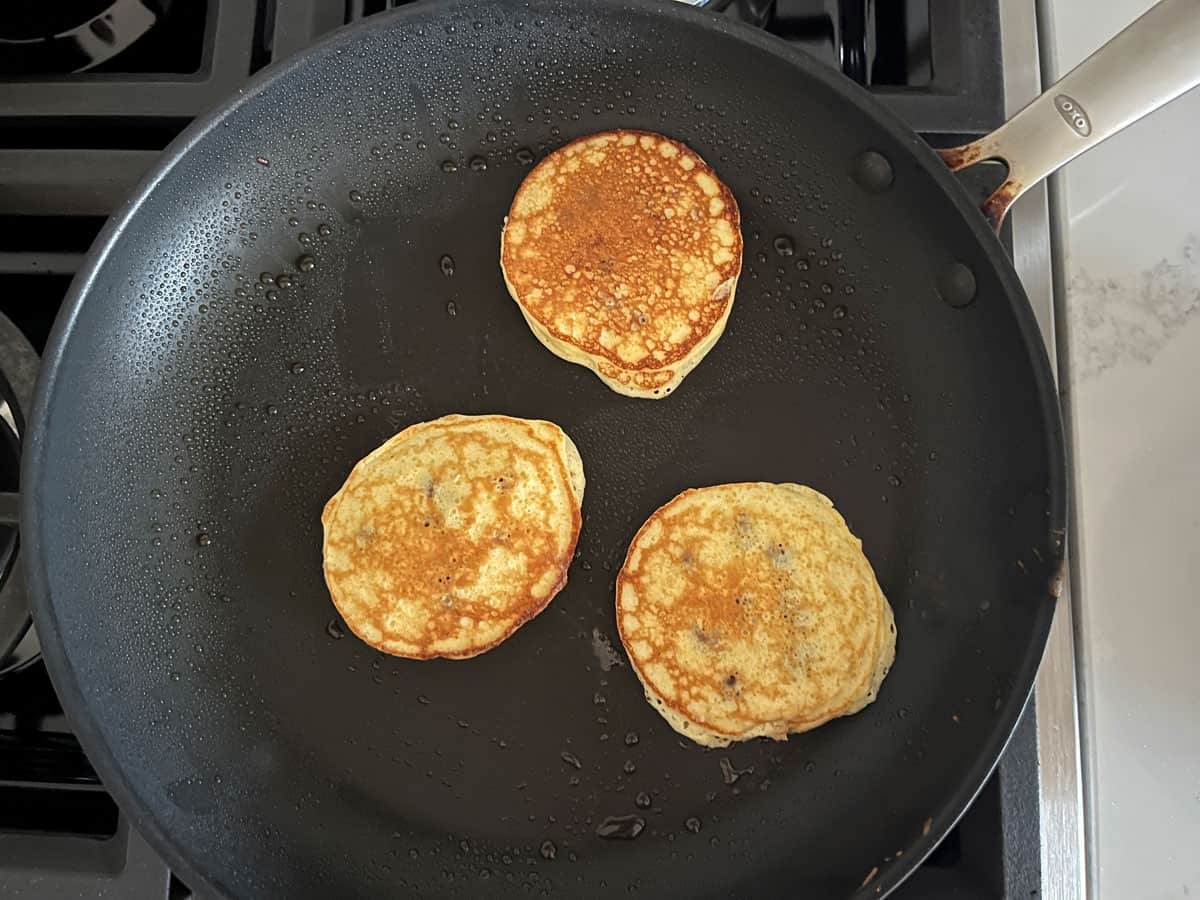 Protein pancakes were flipped in the skillet.