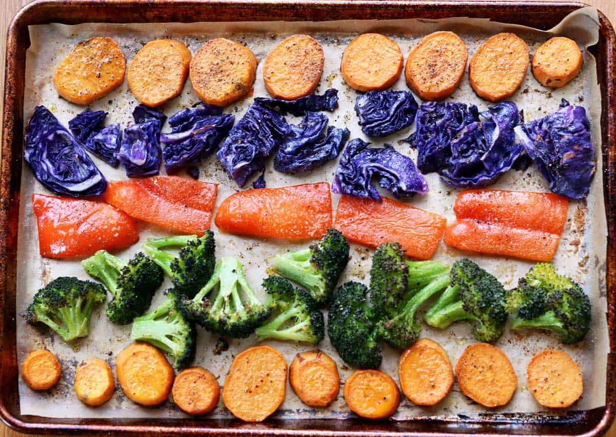 A variation on roasted vegetables: sweet potato, purple cabbage, red bell peppers, and broccoli.
