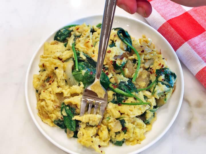Spinach and eggs scramble is served.