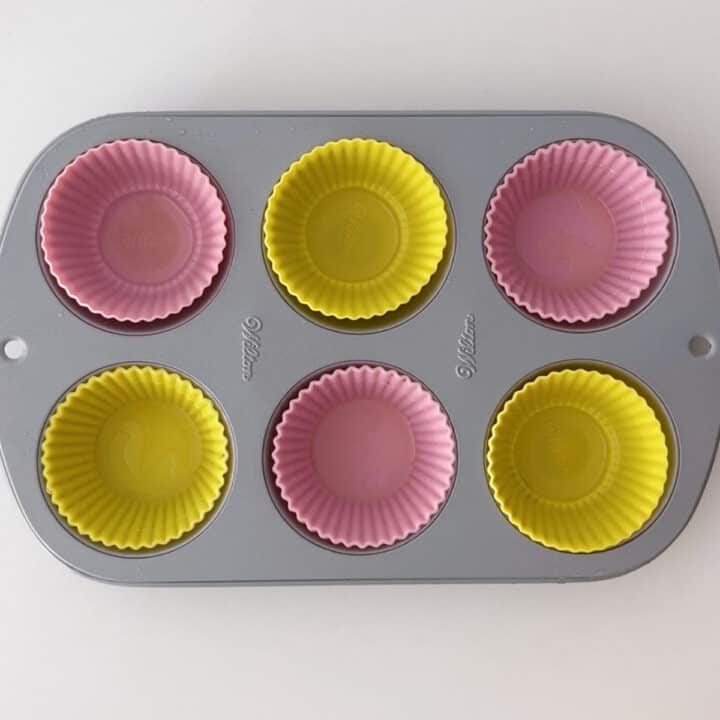 A muffin pan with silicone molds.
