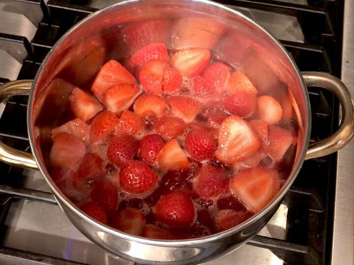 Simmer the strawberries until soft.