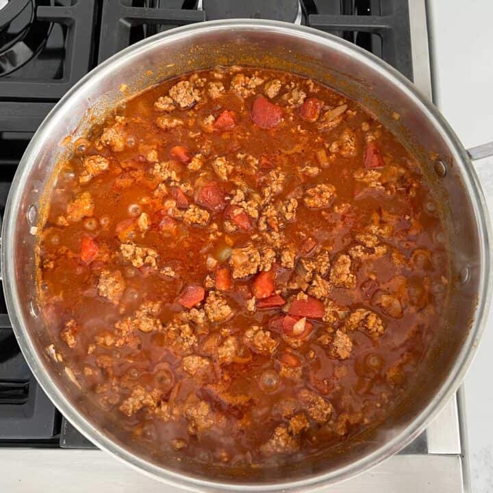Simmering the chili.