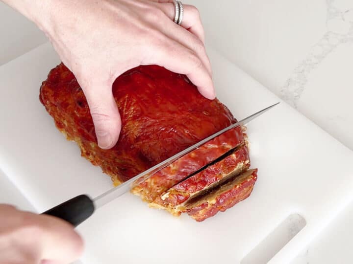 Slicing the meatloaf.