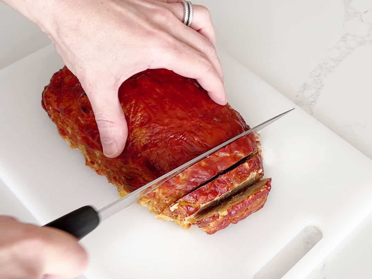Slicing the meatloaf.